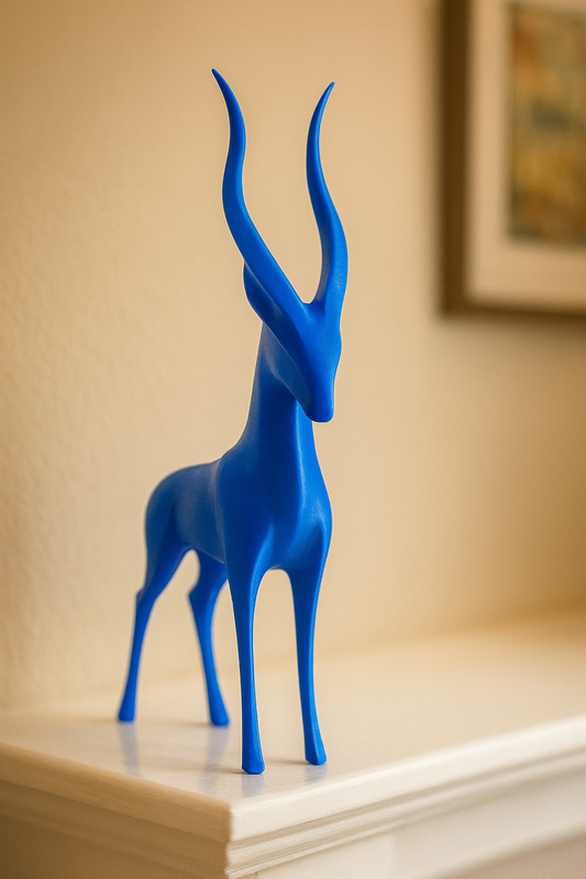 Blue antelope figurine on a shelf with a beige wall in the background